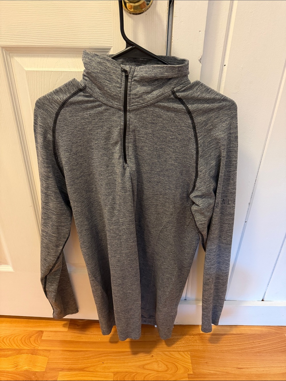 Alphalete Blue-Gray Heather Quarter-Zip Hoodie with Subtle Logo.